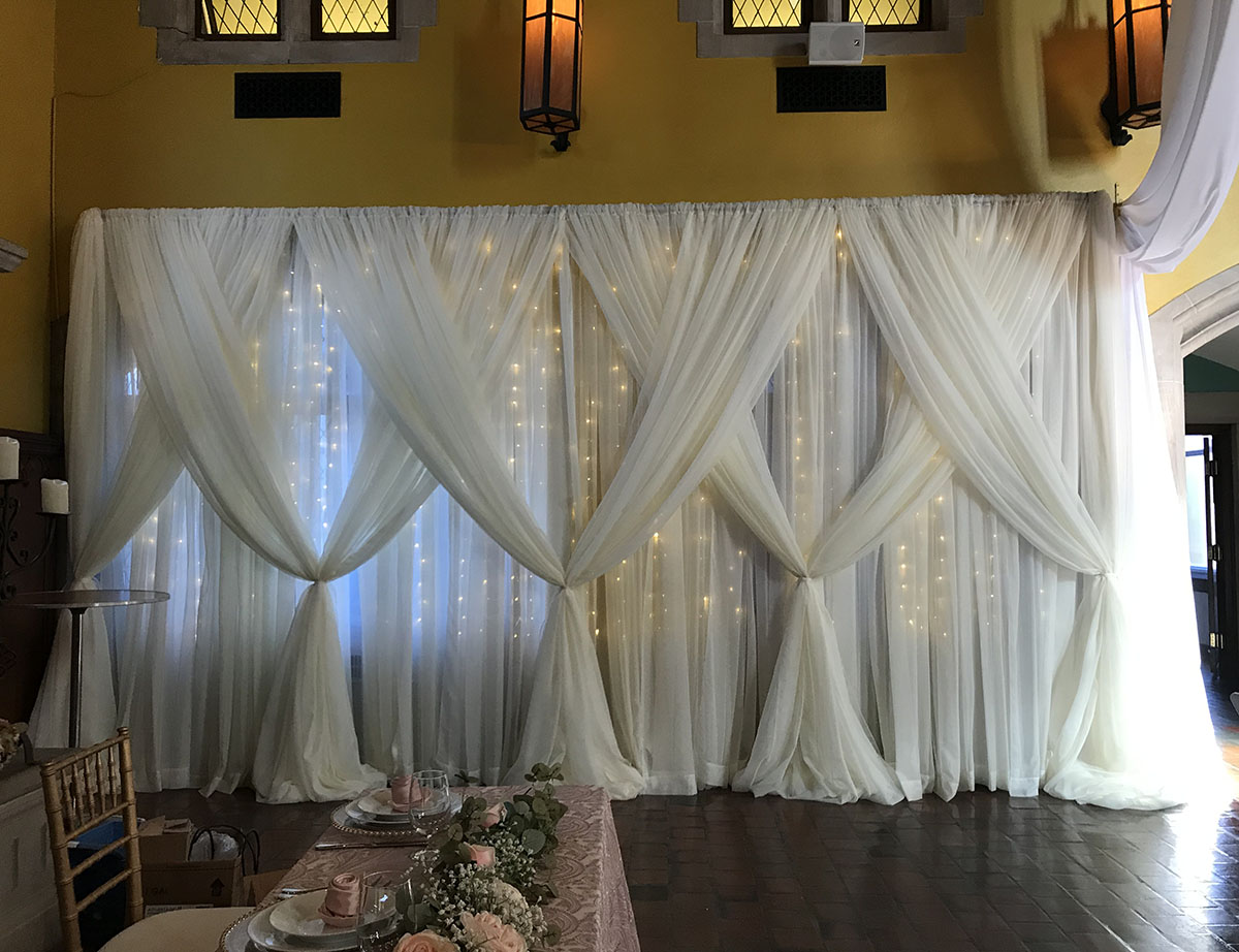 Sheer White Backdrop 20'W x 10'T With Sheer White Front Layer Crisscrossed With Mini Lights